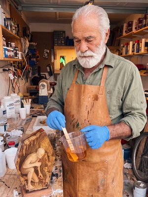 Color being mixed into resin by hand